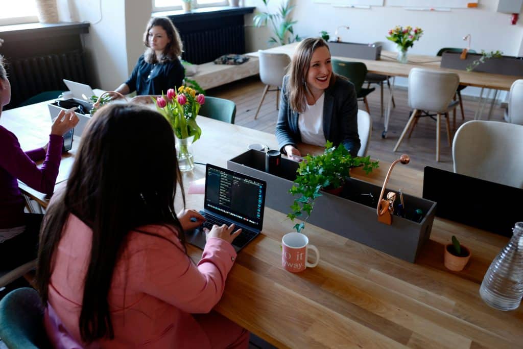 Woman Sitting on the Chair Using Laptop